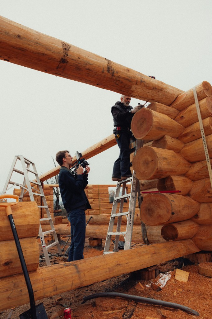 Filming log home construction on site